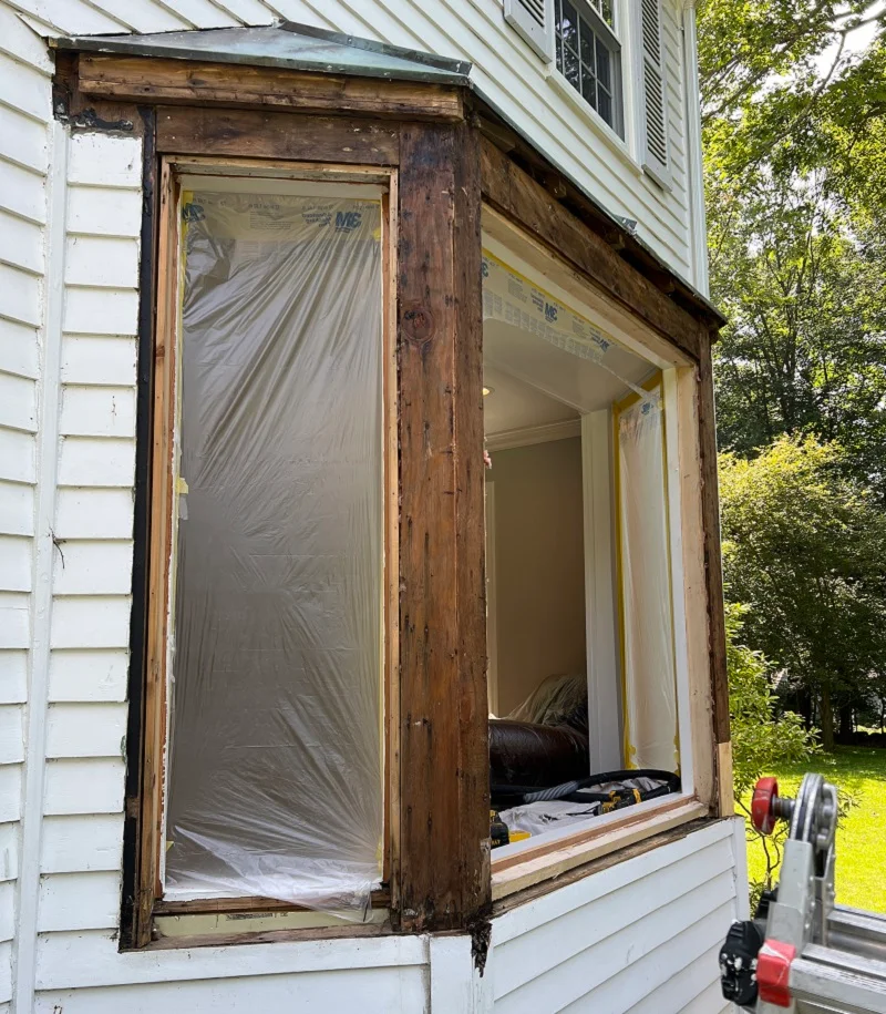 The damaged window sills on this bay window have been removed